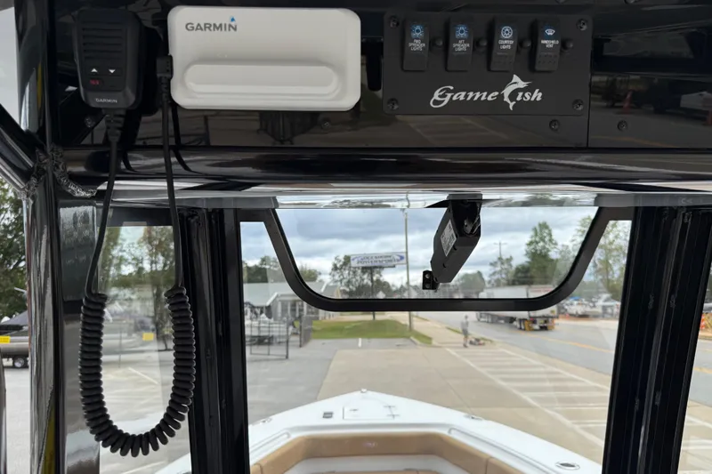 Slide: The Image of 2021 Sea Hunt Gamefish 27 dashboard with Garmin electronics and control panel. - 34