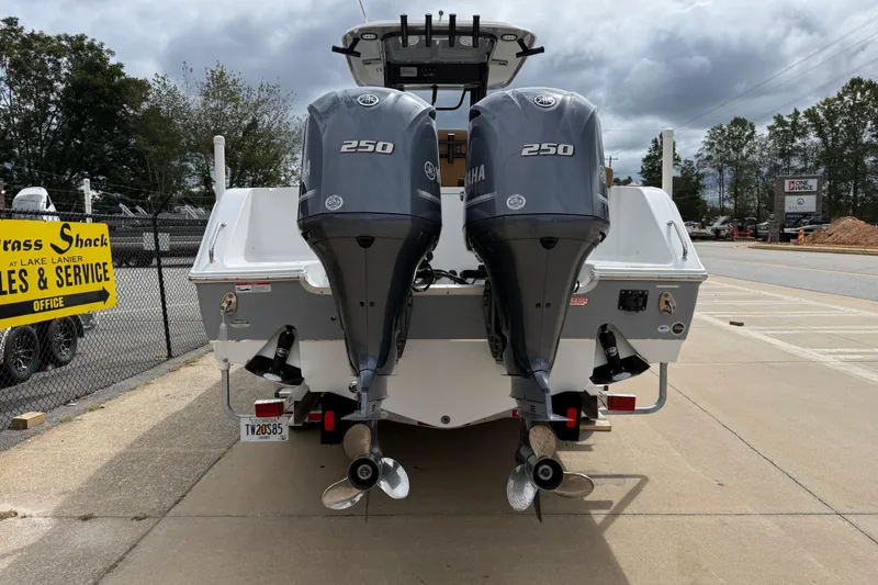 Slide: The Image of 2021 Sea Hunt Gamefish 27 with twin Yamaha 250 engines at a service center. - 4