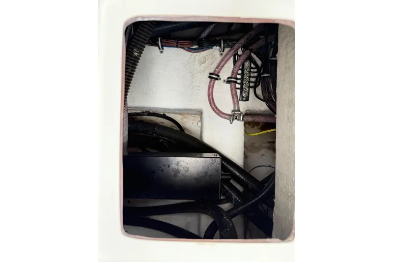 Slide: The Image of 2021 Sea Hunt Gamefish 27 Forward Seating boat wiring and plumbing compartment. - 45