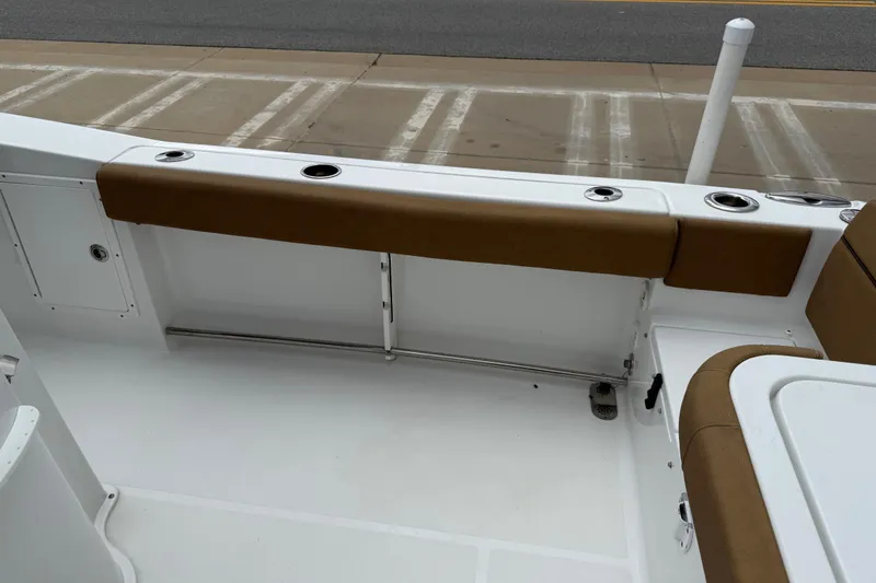 Slide: The Image of 2021 Sea Hunt Gamefish 27 Forward Seating boat interior with cushioned seating and rod holders. - 46