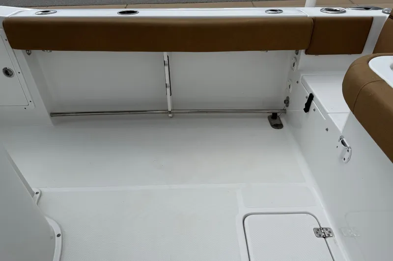 Slide: The Image of 2021 Sea Hunt Gamefish 27 Forward Seating interior with brown cushioned seating. - 53