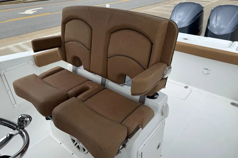 Slide: The Image of 2021 Sea Hunt Gamefish 27 boat with brown forward seating and dual outboard motors. - 55