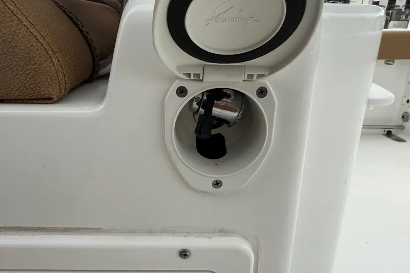 Slide: The Image of 2021 Sea Hunt Gamefish 27 Forward Seating boat detail, featuring a storage compartment. - 58