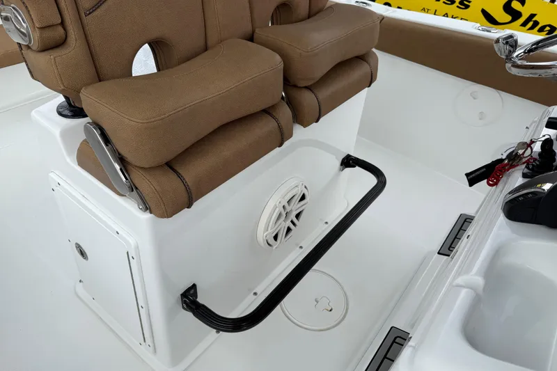 Slide: The Image of 2021 Sea Hunt Gamefish 27 boat seating with brown cushions and white console. - 63
