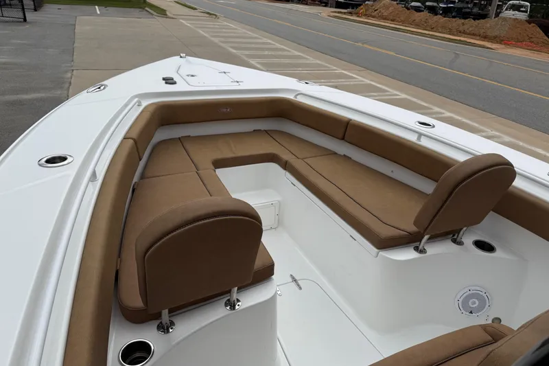 Slide: The Image of 2021 Sea Hunt Gamefish 27 Forward Seating with tan cushions and spacious layout. - 7