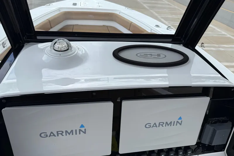 Slide: The Image of 2021 Sea Hunt Gamefish 27 dashboard with Garmin displays and compass. - 72