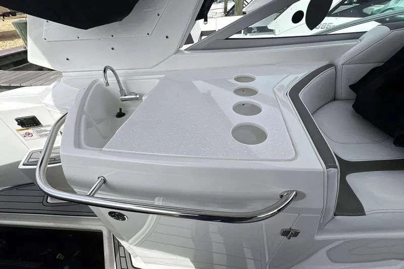 Slide: The Image of Luxury 2020 Monterey 355 Sport Yacht interior with sleek sink and seating area. - 11