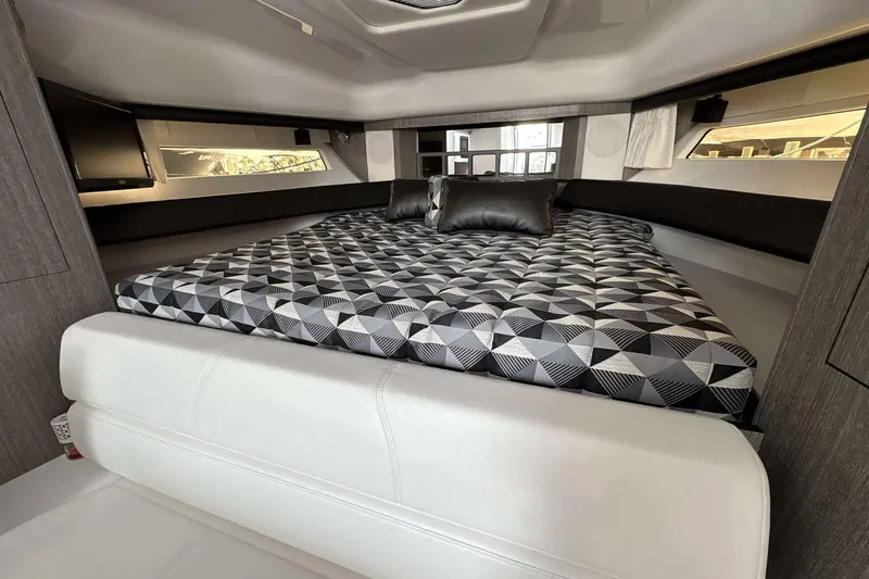 Slide: The Image of Luxurious interior of 2020 Monterey 355 Sport Yacht with geometric-patterned bedding. - 15