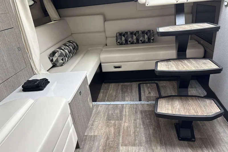 Slide: The Image of Luxurious interior of 2020 Monterey 355 Sport Yacht with modern seating and stylish staircase. - 16