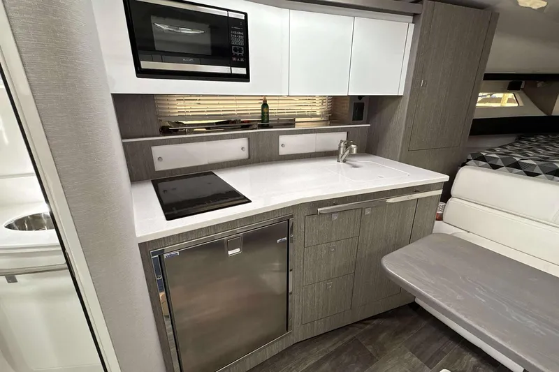 Slide: The Image of Modern kitchen interior of 2020 Monterey 355 Sport Yacht with sleek appliances and cabinetry. - 19
