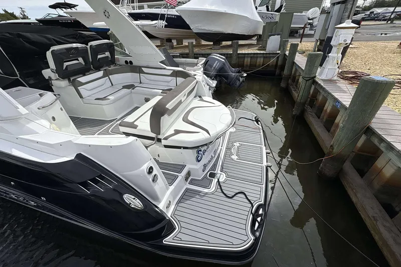 Slide: The Image of 2020 Monterey 355 Sport Yacht docked, featuring spacious seating and sleek design. - 26