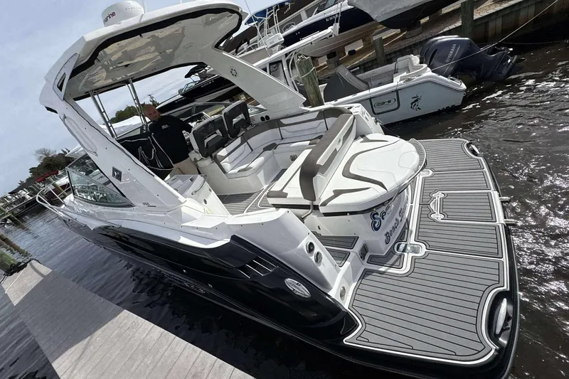 Slide: The Image of 2020 Monterey 355 Sport Yacht docked, showcasing sleek design and spacious deck. - 27