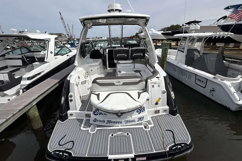 Slide: The Image of 2020 Monterey 355 Sport Yacht docked at marina, featuring spacious seating and sleek design. - 28