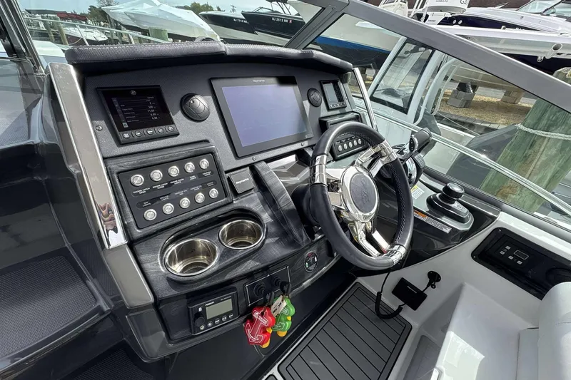 Slide: The Image of Cockpit of 2020 Monterey 355 Sport Yacht with modern controls and steering wheel. - 5