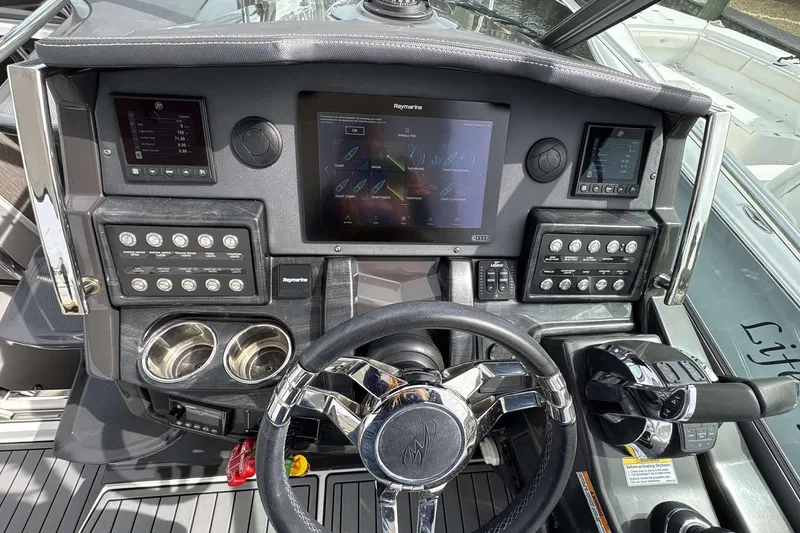 Slide: The Image of Cockpit of 2020 Monterey 355 Sport Yacht with advanced navigation controls and displays. - 6