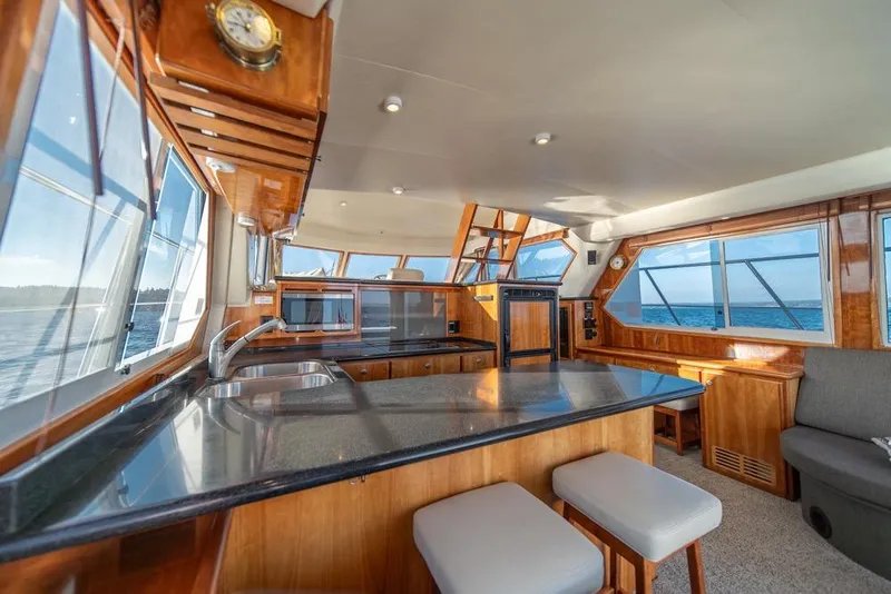 Slide: The Image of Luxurious 2007 Navigator Classic 48 yacht interior with modern kitchen and ocean views. - 11