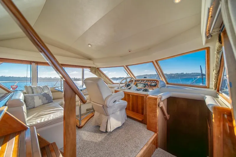 Slide: The Image of Luxurious interior of 2007 Navigator Classic 48 yacht with panoramic windows and plush seating. - 12