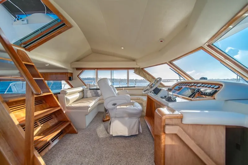 Slide: The Image of Luxurious interior of 2007 Navigator Classic 48 yacht with panoramic windows and plush seating. - 13