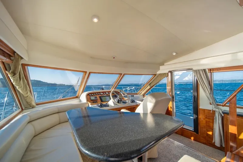 Slide: The Image of Luxurious interior of 2007 Navigator Classic 48 yacht with panoramic ocean views. - 15