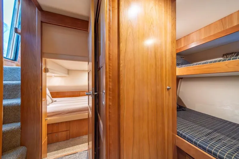Slide: The Image of Interior of 2007 Navigator Classic 48 yacht with cozy wooden cabin and bunk beds. - 17