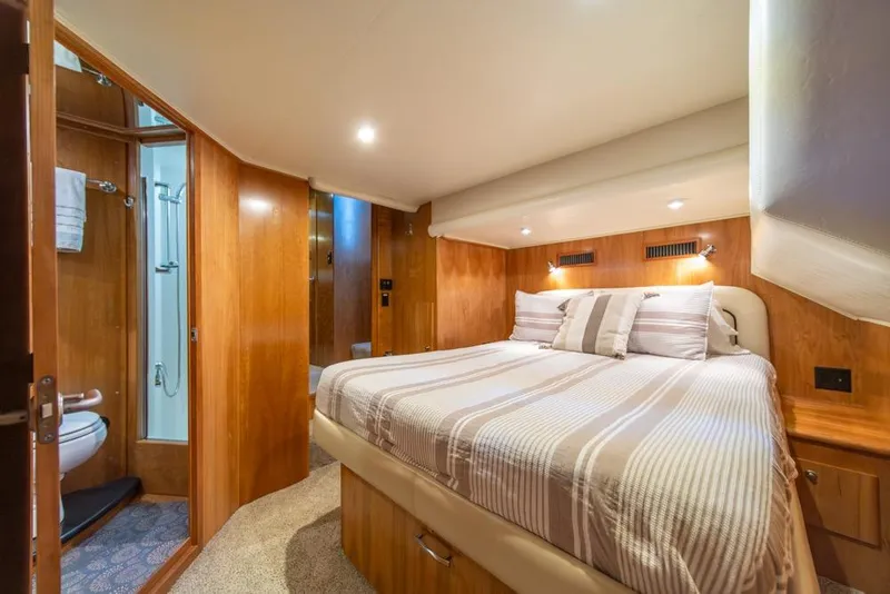 Slide: The Image of Luxurious bedroom interior of 2007 Navigator Classic 48 yacht with ensuite bathroom. - 19