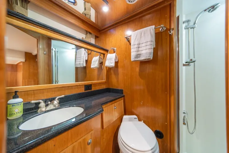 Slide: The Image of Luxurious bathroom in 2007 Navigator Classic 48 yacht with wood accents and modern fixtures. - 22