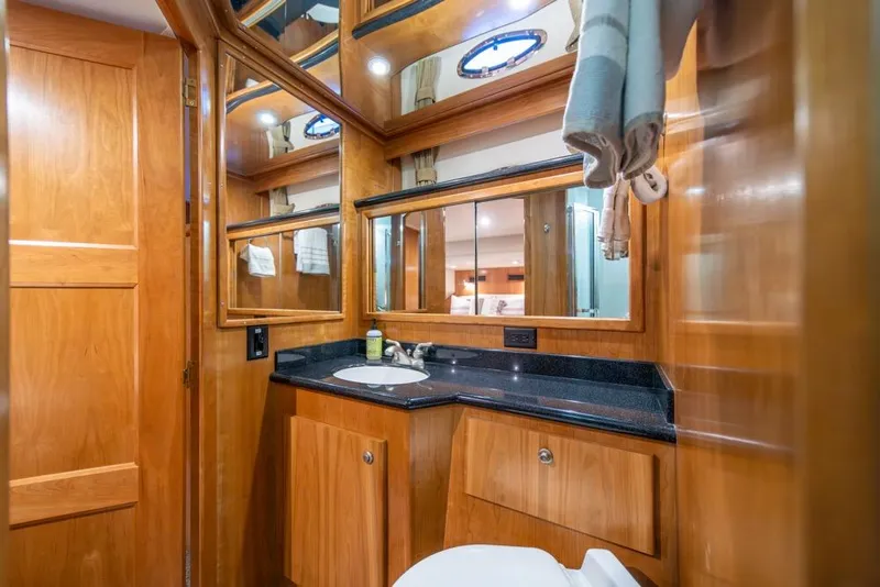 Slide: The Image of Luxurious bathroom interior of 2007 Navigator Classic 48 yacht with wooden cabinetry. - 23