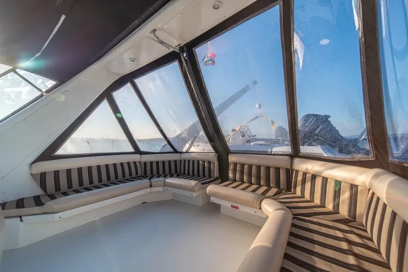 Slide: The Image of Interior of 2007 Navigator Classic 48 yacht with striped seating and panoramic windows. - 35