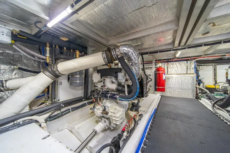 Slide: The Image of Engine room of 2007 Navigator Classic 48 yacht, featuring pipes and machinery. - 42