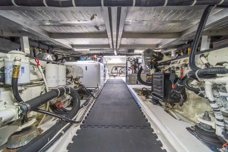 Slide: The Image of Engine room of 2007 Navigator Classic 48 yacht, showcasing mechanical components and systems. - 44