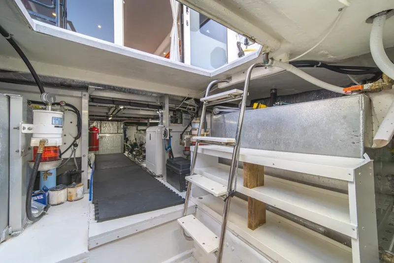 Slide: The Image of Engine room of 2007 Navigator Classic 48 yacht with ladder and equipment. - 47