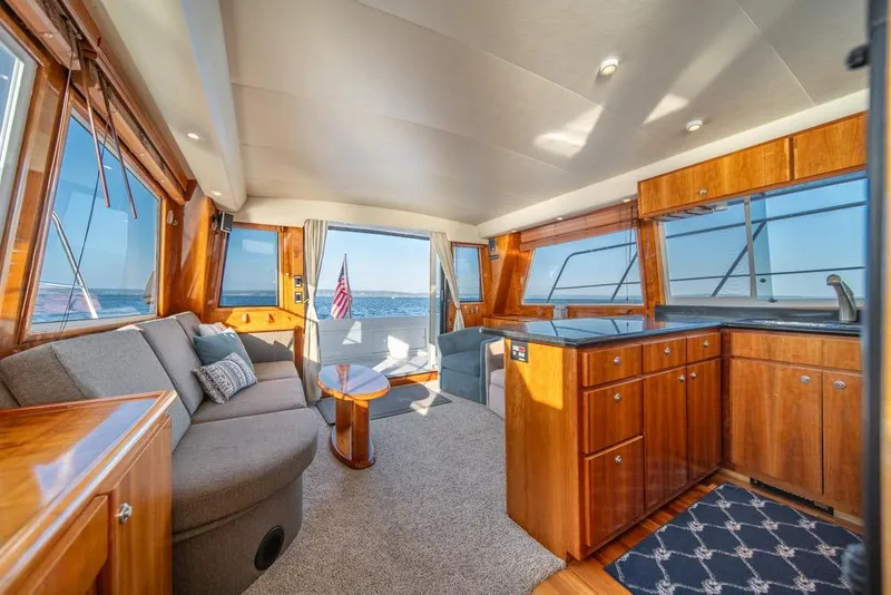 Slide: The Image of Luxurious interior of 2007 Navigator Classic 48 yacht with elegant wood finishes and ocean view. - 9