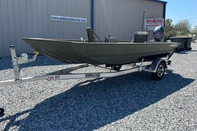 The Image of 2025 Alweld 1856PF boat on trailer, parked on gravel near a building. - 1