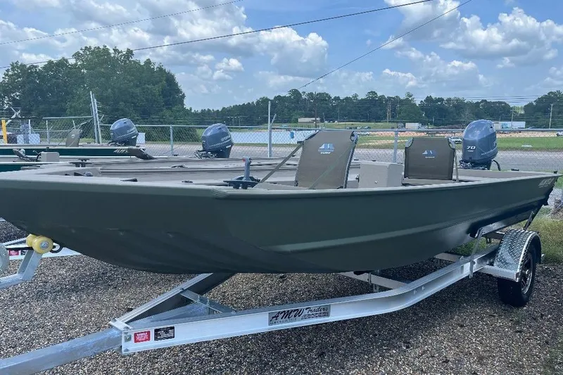 Slide: The Image of 2025 Alweld 1856PF boat on trailer, parked outdoors under a cloudy sky. - 9
