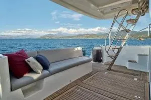 Slide: The Image of 2026 Beneteau Swift Trawler 48 deck with seating, ocean view, and stairs. - 3