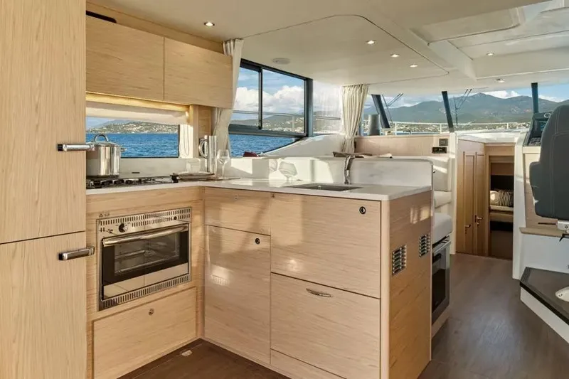 Slide: The Image of Modern kitchen interior of 2026 Beneteau Swift Trawler 48 with ocean view. - 4
