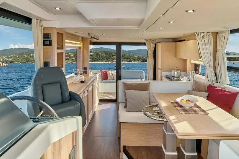 Slide: The Image of Luxurious interior of 2026 Beneteau Swift Trawler 48 with scenic ocean view. - 5