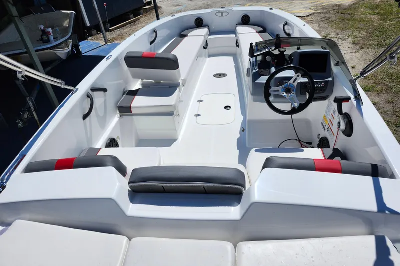 Slide: The Image of 2023 Tahoe T18 boat interior with modern seating and steering console. - 21