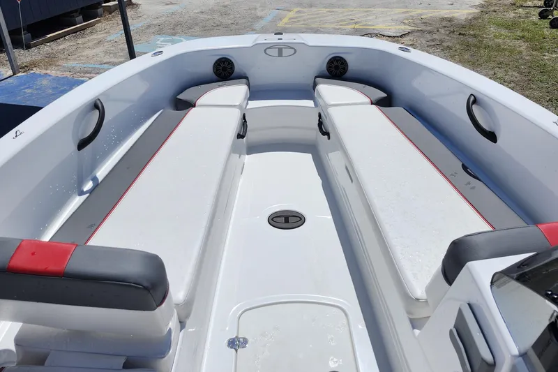 Slide: The Image of 2023 Tahoe T18 boat interior with white seating and red accents. - 7