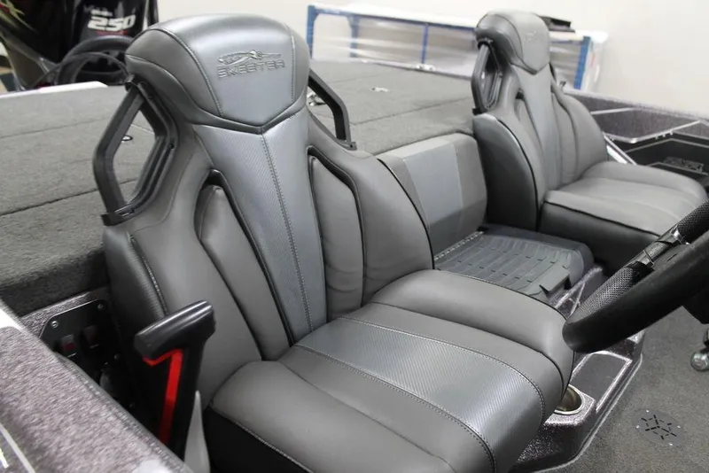 Slide: The Image of 2021 Skeeter ZXR20 boat interior with sleek, modern seating and steering wheel. - 10