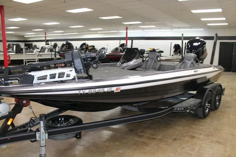 Slide: The Image of 2021 Skeeter ZXR20 boat in showroom, black and white, on trailer. - 3