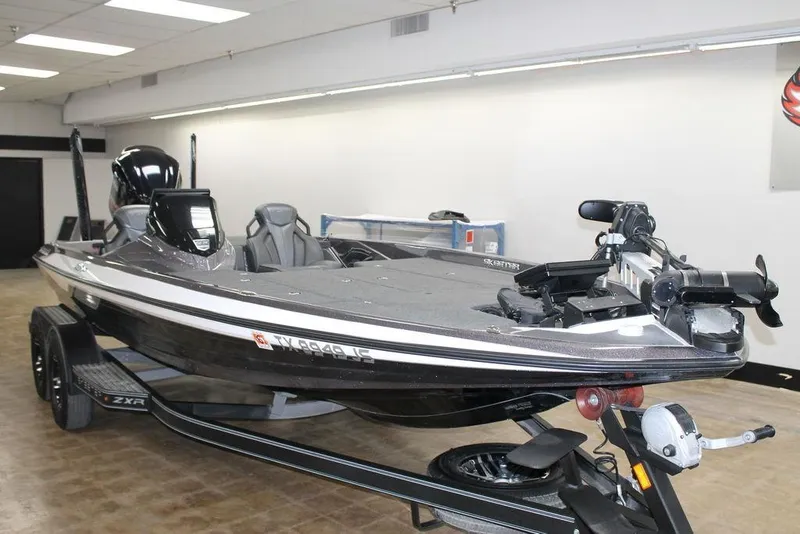 Slide: The Image of 2021 Skeeter ZXR20 bass boat in showroom, featuring sleek design and advanced equipment. - 5