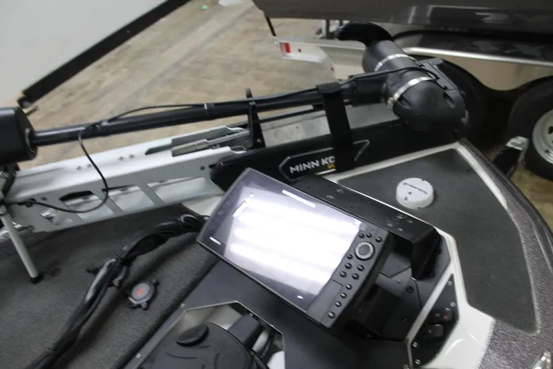 Slide: The Image of 2021 Skeeter ZXR20 boat dashboard with Minn Kota trolling motor and electronic display. - 7