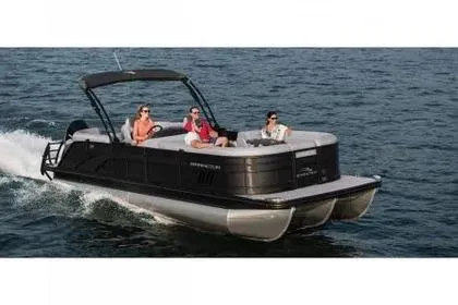 The Image of 2023 Bennington 25 LSRC pontoon boat cruising on water with passengers. - 1