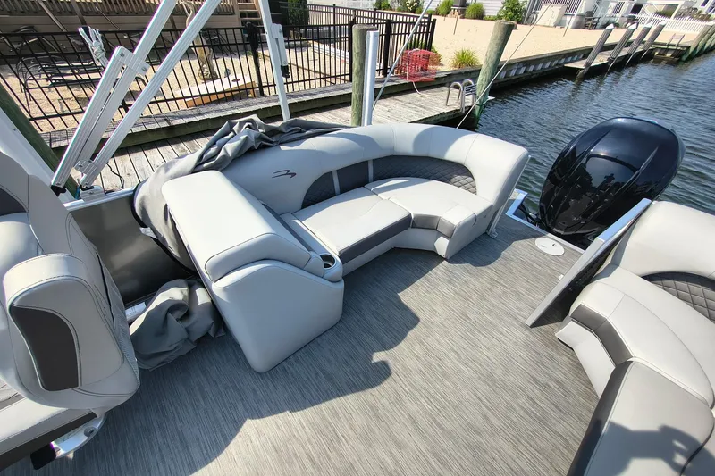 Slide: The Image of 2023 Bennington 25 LSRC pontoon boat interior with plush seating and modern design. - 6