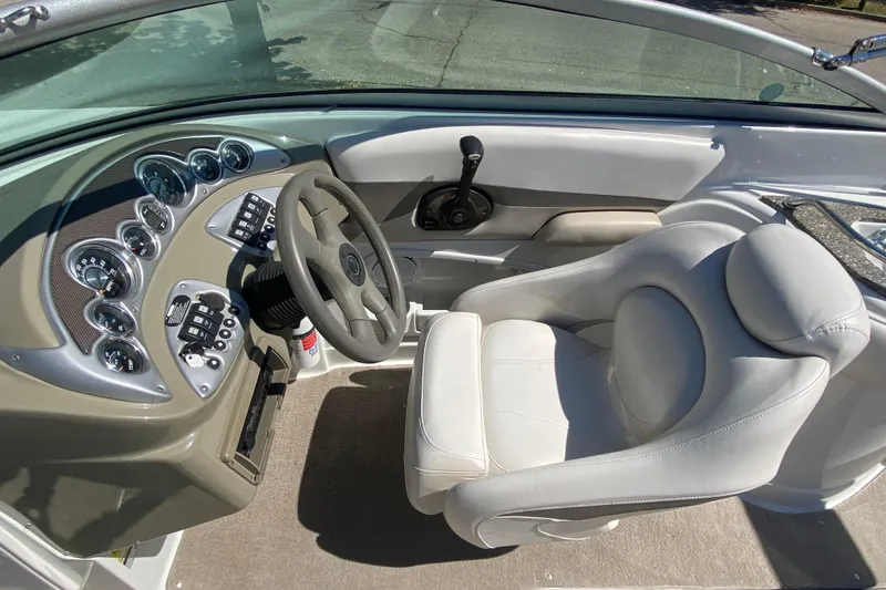 Slide: The Image of 2007 Crownline 252 EX boat cockpit with steering wheel and control panel. - 10