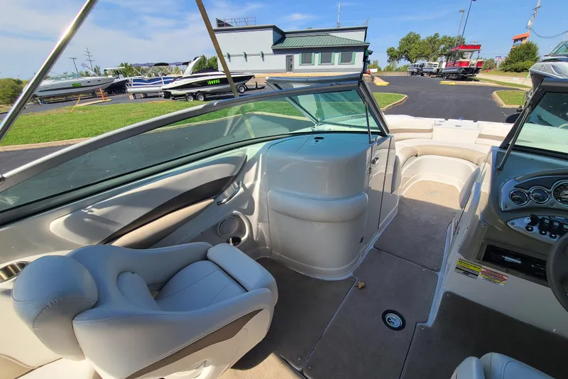 Slide: The Image of Interior view of a 2007 Crownline 252 EX boat, showcasing seating and dashboard. - 8