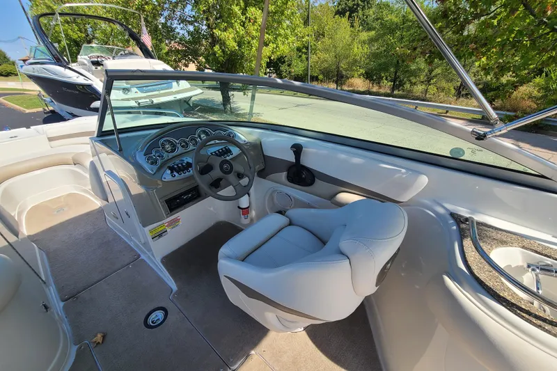 Slide: The Image of 2007 Crownline 252 EX boat interior with steering wheel and seating. - 9