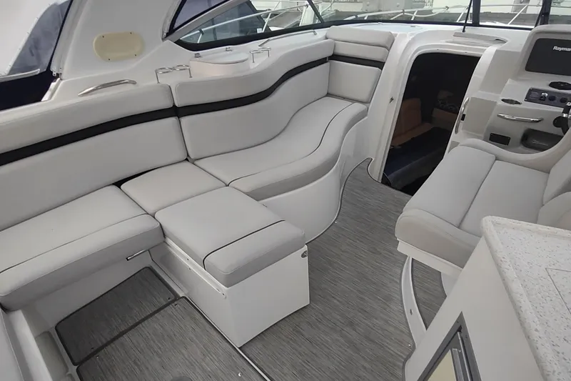 Slide: The Image of 2017 Rinker EX 320 boat interior with plush seating and modern design. - 30