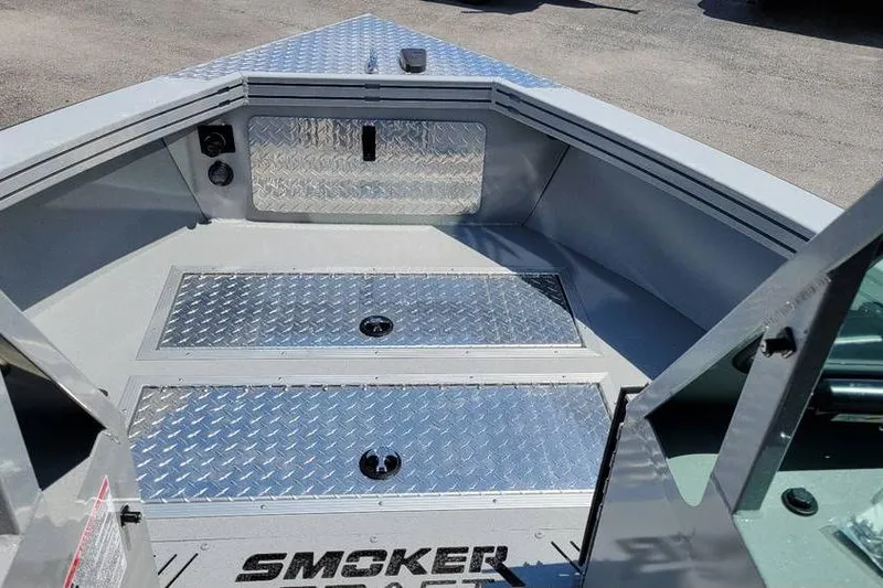 Slide: The Image of 2025 Smoker Craft Phantom 20 X2 OS boat interior with diamond plate flooring. - 19